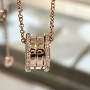 Two-sided spring pendant necklace with diamonds