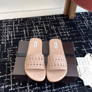 Perforated and carved leather sandals with flat sole