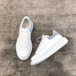 Light blue Alexander McQueen white leather snakeskin sneakers