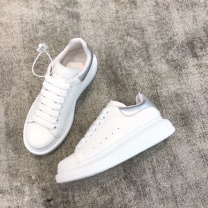 Silver tail Alexander McQueen white leather snakeskin sneakers