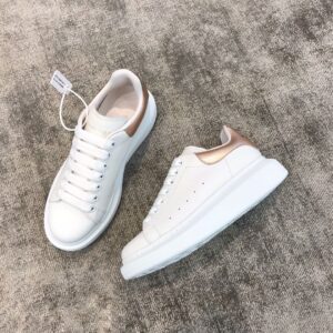 Gold colored white leather snakeskin sneakers