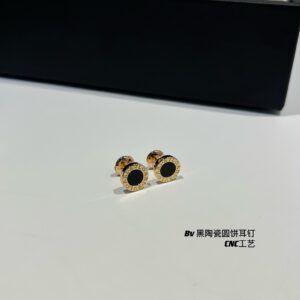 Black ceram€ round disc stud earrings