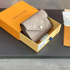 Zoé wallet with Monogram Empreinte leather