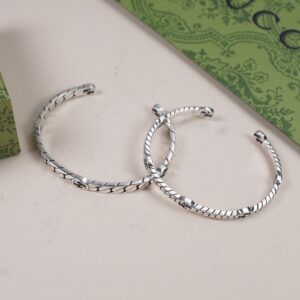 Dually interlocking silver bracelet pair
