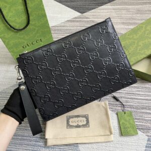 Black leather GG embossed leather handbag