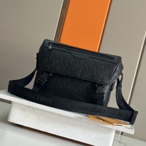 Voyager small messenger bag in monogram shadow leather