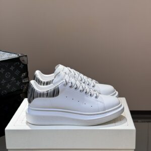 Alexander McQueen couple thick sole elevating shoes