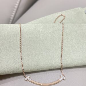 Tiffany drilled smiley face necklace
