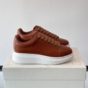 Alexander McQueen couple thick sole elevating shoes
