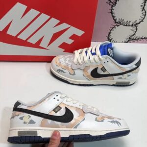 Nike Dunk Low SB sneakers with graffiti design