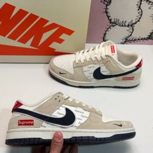 Nike Dunk Low SB sneakers with red tail pattern