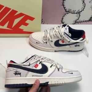 Nike Dunk Low SB sneakers with Stüssy pattern