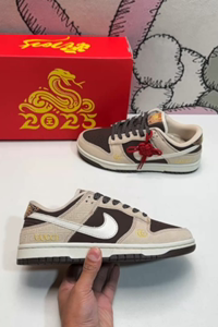 Nike Dunk Low SB sneakers with Gucci pattern