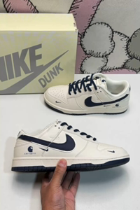 Nike Dunk Low SB sneakers with silver edging
