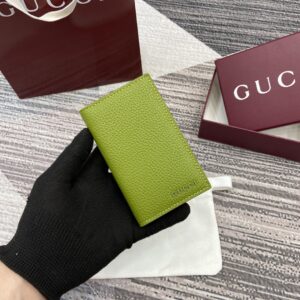 Green bifold wallet with Gucci logo