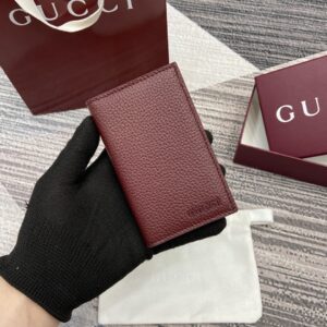 Red bifold wallet with Gucci logo