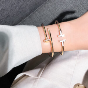 Classic solid nut-studded bracelet with push-button clasp